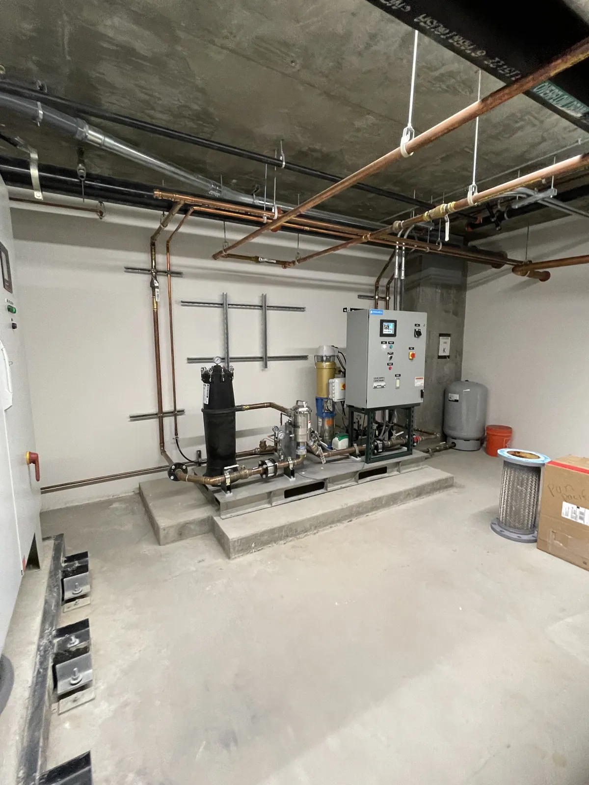 Grey water system with copper piping, filtration housing and control panel installed by Poseidon Plumbing